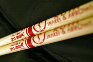 a pair of wooden drumsticks