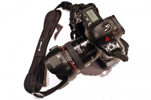 a black camera with a strap