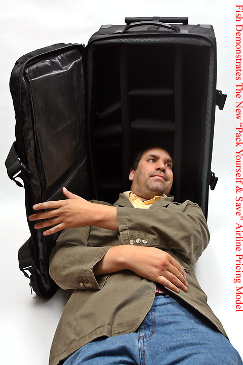 a man lying in a suitcase