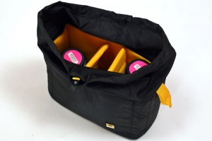 a black bag with yellow and pink objects inside