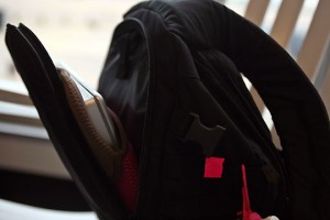 a black backpack with a red tag