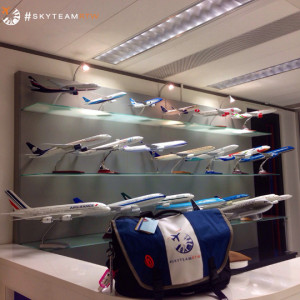a display of model airplanes on shelves