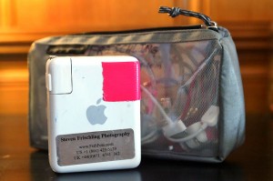 a white and pink device next to a clear bag