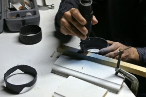 a person using a drill to drill metal