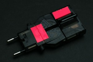 a black and pink electrical device