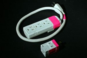 a white and pink extension cord