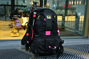 a black backpack with pink straps