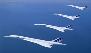 a group of white airplanes in the sky