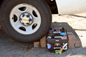 a car tire with a toolbox on the side