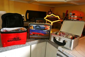 a lunchbox and a laptop on a counter