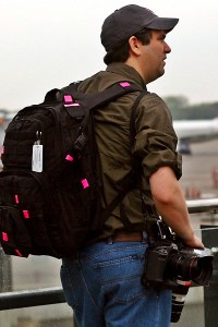 a man with a backpack and camera