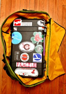 a suitcase with stickers inside of it