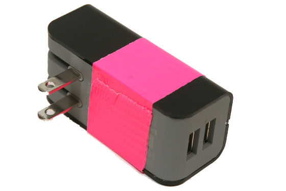 a black and pink electrical plug