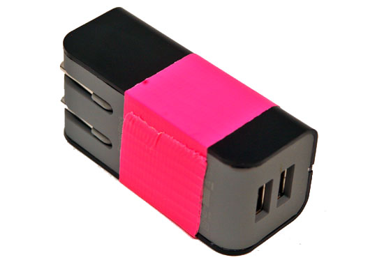 a black and pink usb adapter