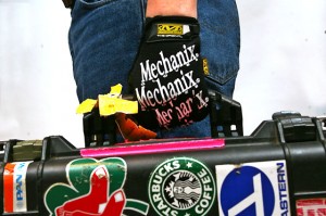 a person's hand holding a toolbox