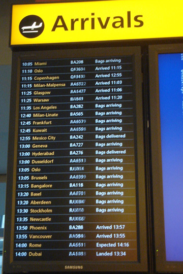 a sign with a list of flights