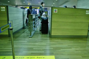 a man with luggage in a airport