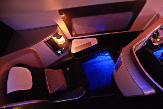 an airplane seat with a blue light