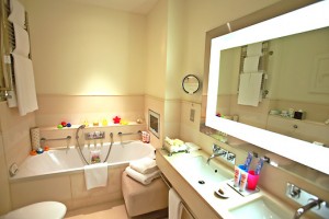 a bathroom with a bathtub and a mirror