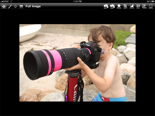 a boy with a large camera