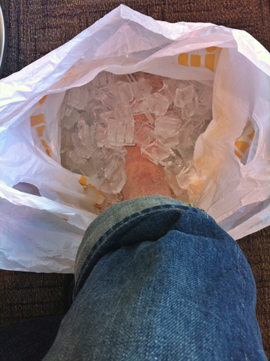 a person's leg in a plastic bag with ice