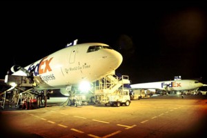 a plane at the airport at night