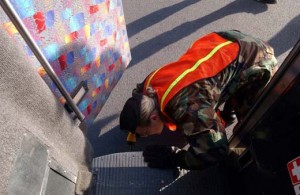a woman in a military uniform looking down a step