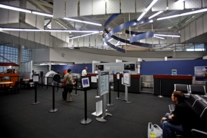 people in an airport check-in counter