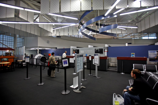 people in an airport check-in counter