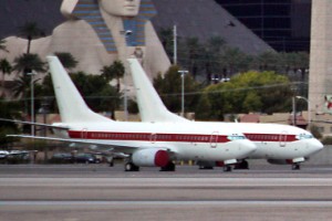 a couple of airplanes on a runway