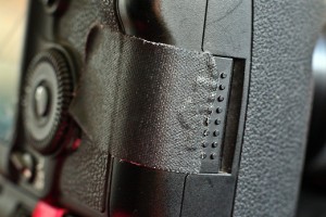 a black strap on a camera