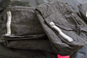 a stack of folded black clothes