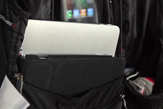 a laptop and tablet in a black bag