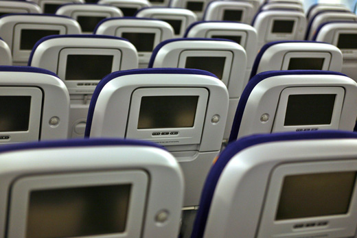 rows of seats with screens