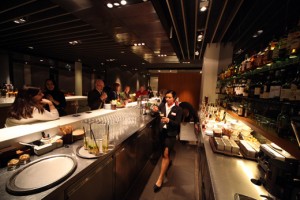 a woman standing in a bar