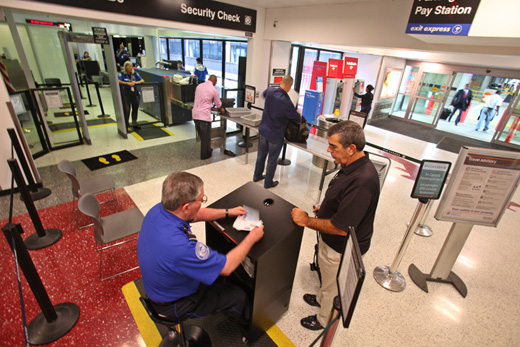 men standing at a check-in counter