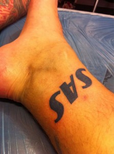 a tattoo on a person's ankle