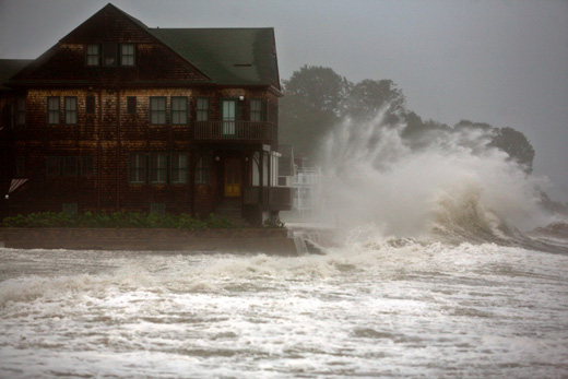 a house with waves crashing against it
