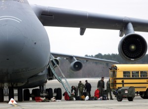 a group of people getting ready to board a plane