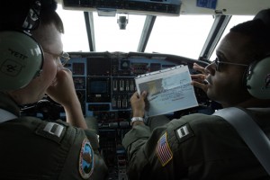 a few pilots in the cockpit of a plane