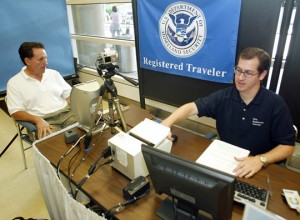 a man sitting at a desk with a camera