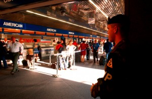 a man standing in a line at an airport
