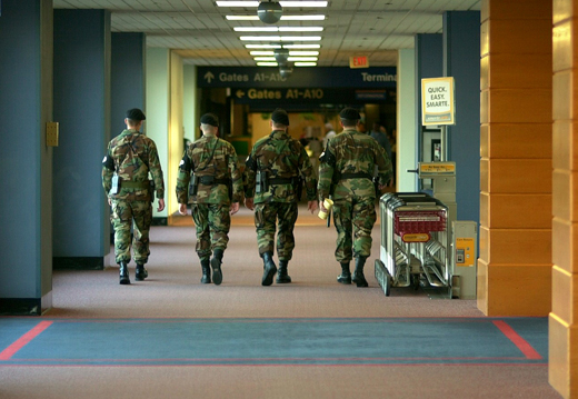 a group of soldiers walking in a hallway