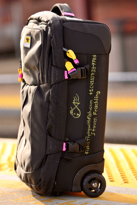 a black bag with yellow writing on it