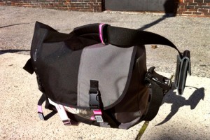 a black and grey bag on the ground