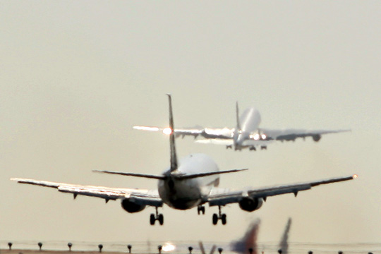 a group of airplanes taking off