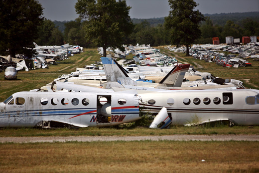 a group of airplanes in a field