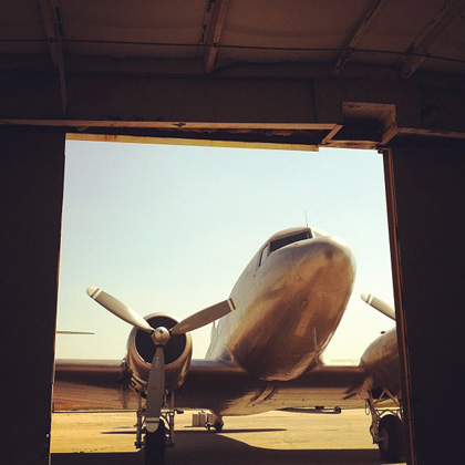 an airplane parked in a hangar