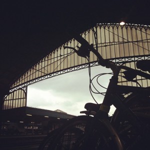 a bicycle parked in a train station