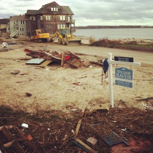 a construction site with a sign and construction equipment